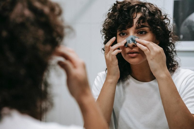 girl removing black head.jpg